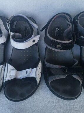 TWO PAIRS Clarks Wave womens sandals size 9.5 good shape! One black one white!
